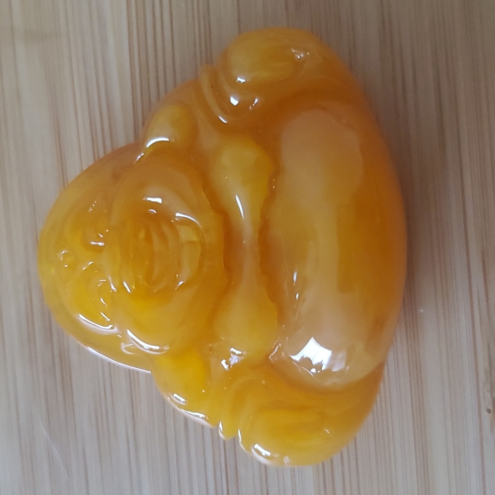 New Carved Man-Made Amber Buddha Pendant.